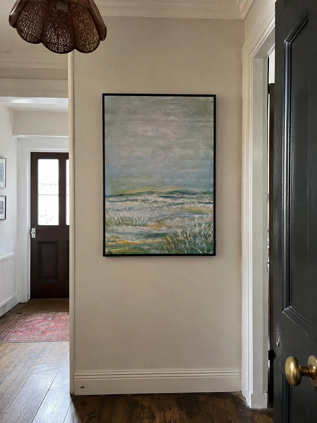 Sonia Anton painting in a Spanish hallway